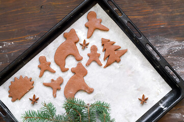 Cooking ginger cookies on Christmas Eve. Christmas mood or food design.