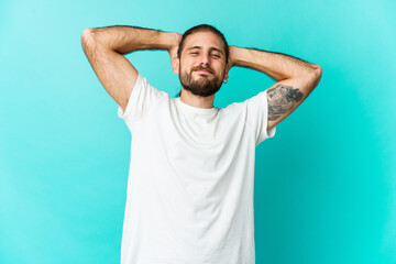 Young man with long hair look stretching arms, relaxed position.