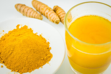 Turmeric. A healthy spice of yellow color, used in many cuisines of the world. Various variants, Powder, served in a glass of drinking water and as a root