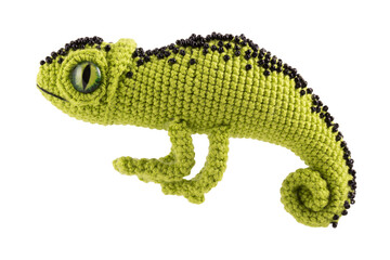 Beautiful green knitted chameleon on a white background, soft toy.