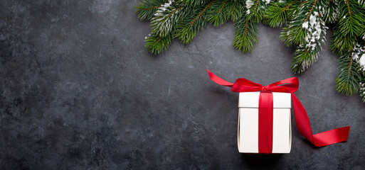 Christmas greeting card with fir tree and gift box