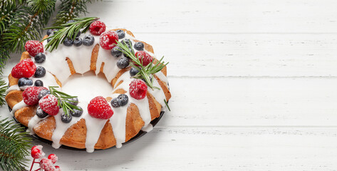 Christmas cake with berries and rosemary