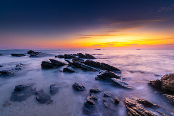 Fototapeta na wymiar A long exposure of sunrise on the beach of Thailand