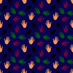 Fototapeta na wymiar multicolored hand prints on blue background