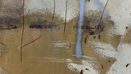 Rusty sheet metal painted with different colors of paints

