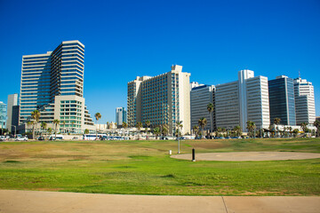 Fototapeta na wymiar modern city green square with skyscraper buildings landmark view in summer clear weather day time Tel Aviv capital of Israel urban photography