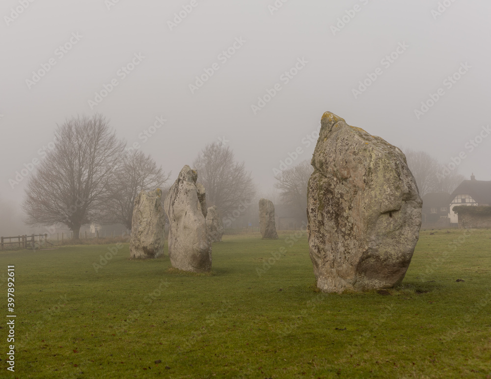 Wall mural Misty morning at the Avebury standing stones.