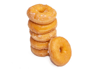 donuts with icing sugar stacked on white background