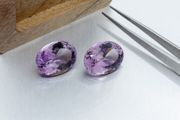 macro mineral faceted stone cut Amethysts on a gray background