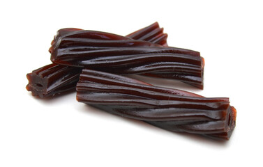 Black licorice candies isolated on white background 