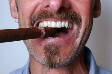 Man smiling and celebrating with a cigar
