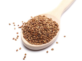 Buckwheat pile in wooden spoon isolated on white background