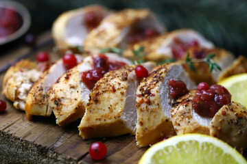 Turkey fillet with cranberry sauce. Festive food. Christmas mood.