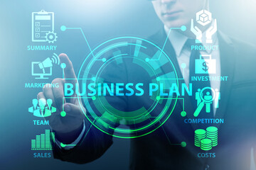 Business plan concept with businessman pressing button