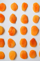 Dry apricots placed on a white board. Place for text 