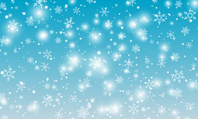 Snow background. Winter snowfall. White snowflakes on blue sky. Christmas background. Falling snow.