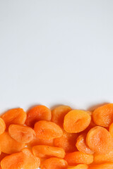 Dry apricots placed on a white board. Place for text 