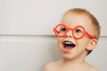 Little boy wearing glasses. A little doctor. Funny portrait of a little child. - 397901080