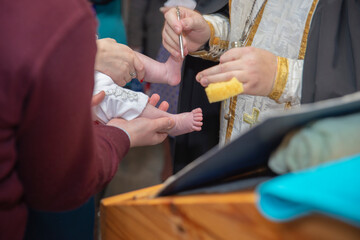 Epiphany in the church. Baby's legs