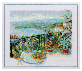 Fototapeta premium Embroidered picture, outdoor cafe terrace overlooking the sea, cross-stitch on textile canvas, isolated on white background