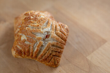 Fresh baked apple turnover on wood