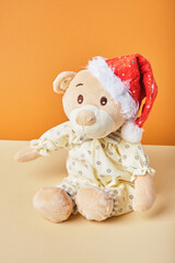 cute plush teddy bear in santa claus hat