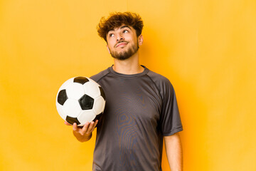 Young soccer player indian man dreaming of achieving goals and purposes