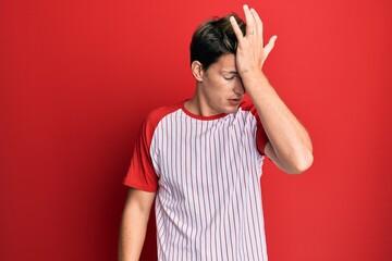 Handsome caucasian man wearing baseball uniform surprised with hand on head for mistake, remember...