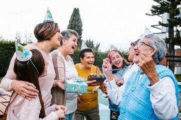 Multi Generation latin women Family Celebrating a happy Birthday in Latin America