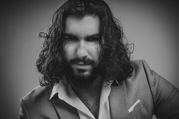 black end white portrait of young man with loose hair