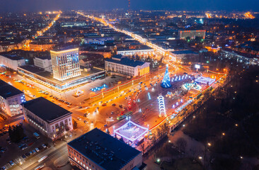 Gomel, Belarus. Main Christmas Tree And Festive Illumination On Lenin Square In Homel. New Year In Belarus. Aerial Night View