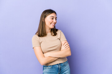 Young caucasian woman smiling confident with crossed arms.