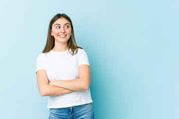 Young caucasian woman smiling confident with crossed arms.