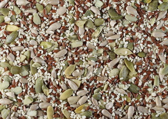 Pile mix seeds, sunflower, sesame, linseed and pumpkin seed background and texture