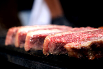 Picanha. Traditional Brazilian meat for barbecue. On wooden background. 