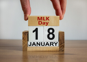 Martin Luther King Day symbol. Wooden block with the words 'MLK Day' on cubes with the date January...