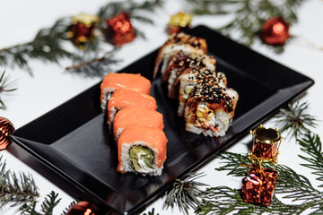 Sushi rolls New Year. Christmas background. Idea for postcard, menu, advertising.