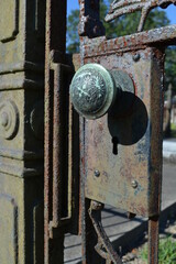 iron gate with door knob in cemetery