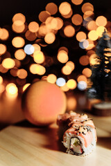 Obraz na płótnie Canvas Sushi rolls New Year. Christmas background. Idea for postcard, menu, advertising.