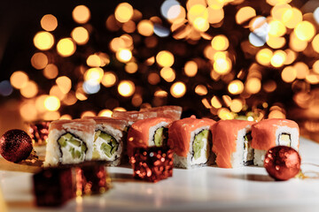 Sushi rolls New Year. Christmas background. Idea for postcard, menu, advertising.