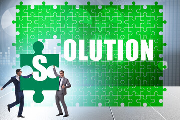 Naklejka premium Solution concept with businessman solving jigsaw puzzle