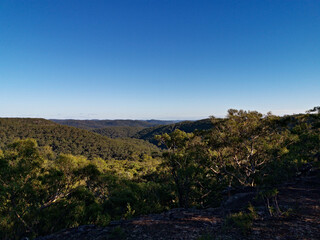 Breathtaking view of mountain and valley landscape on a clear blue sky day, Wideview Lookout, Berowra Heights, Berowra Valley National Park, Sydney, New South Wales, Australia
