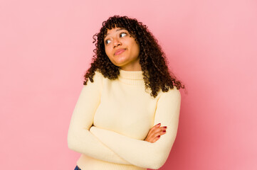 Young african american afro woman isolated dreaming of achieving goals and purposes