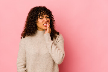 Young african american afro woman isolated having a strong teeth pain, molar ache.