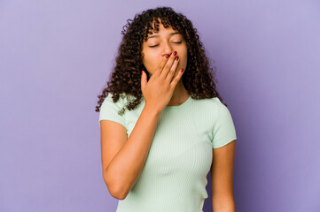 Young african american afro woman isolated yawning showing a tired gesture covering mouth with hand.