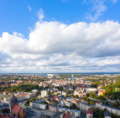 Fototapeta na wymiar Panorama miasta Gorzów Wielkopolski, widok z lotu ptaka na centrum miasta pod masywnymi chmurami, w dalekim tle Urząd Miejski i osiedla