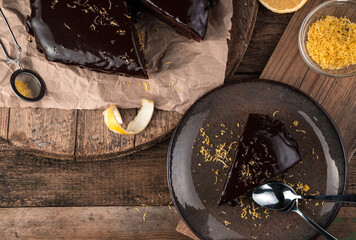 Cooking background with chocolate cake on natural background. Top view, with space to copy. The concept of desserts.