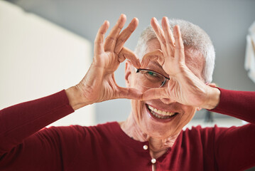 Senior woman sending love