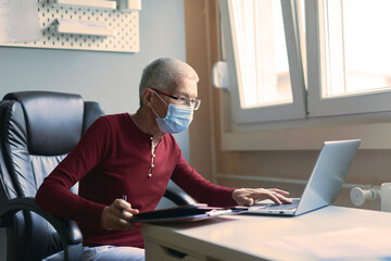 Elderly woman surfing the internet