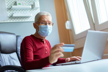 Elderly woman checking her bank account